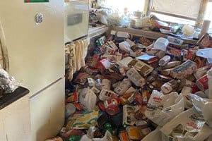 Hoarder Clean Up in Roseville, CA, for a pile of waste products on a kitchen floor