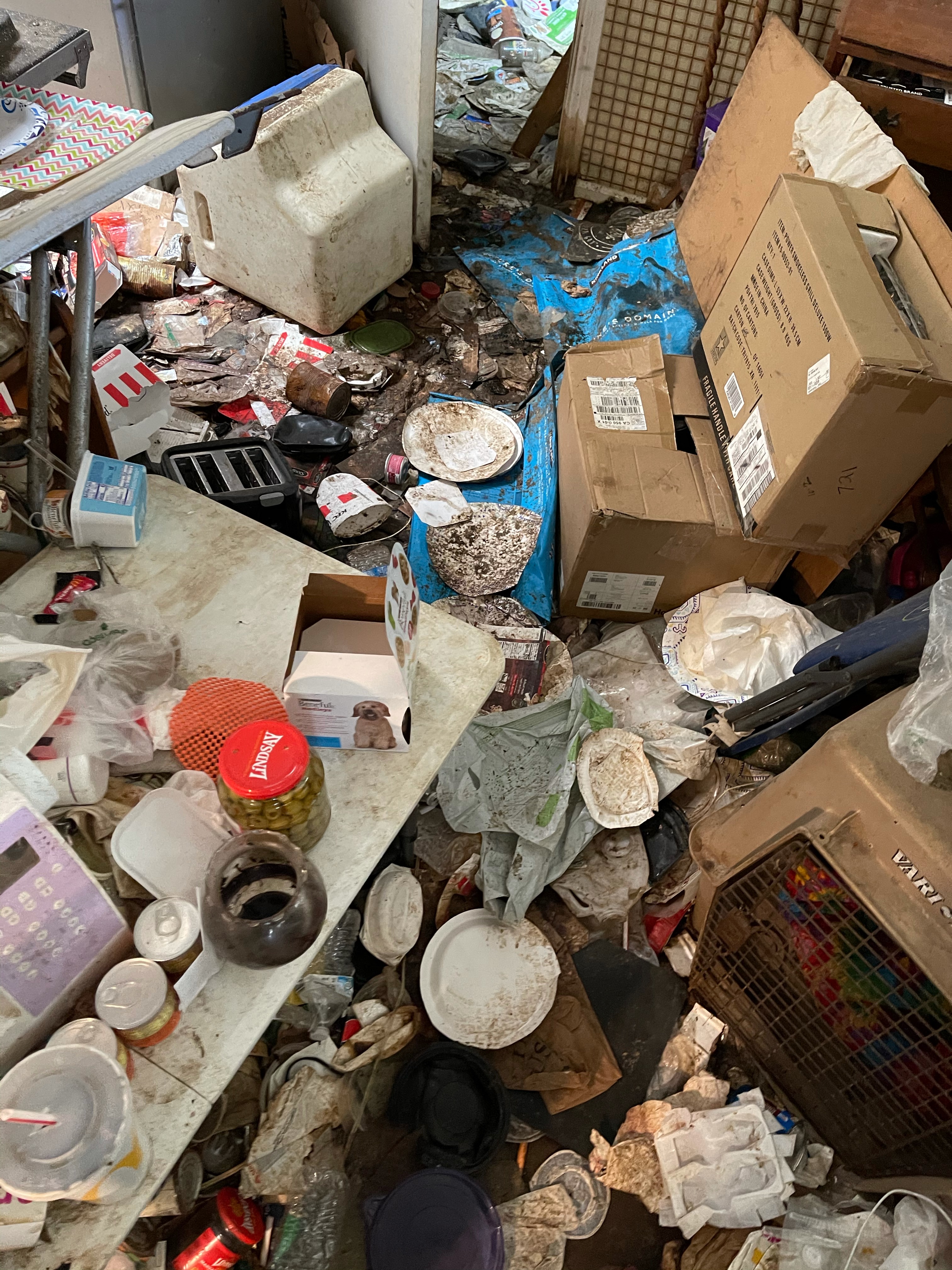 Hoarder Cleaning Redwood City, CA a very messy room with items everywhere